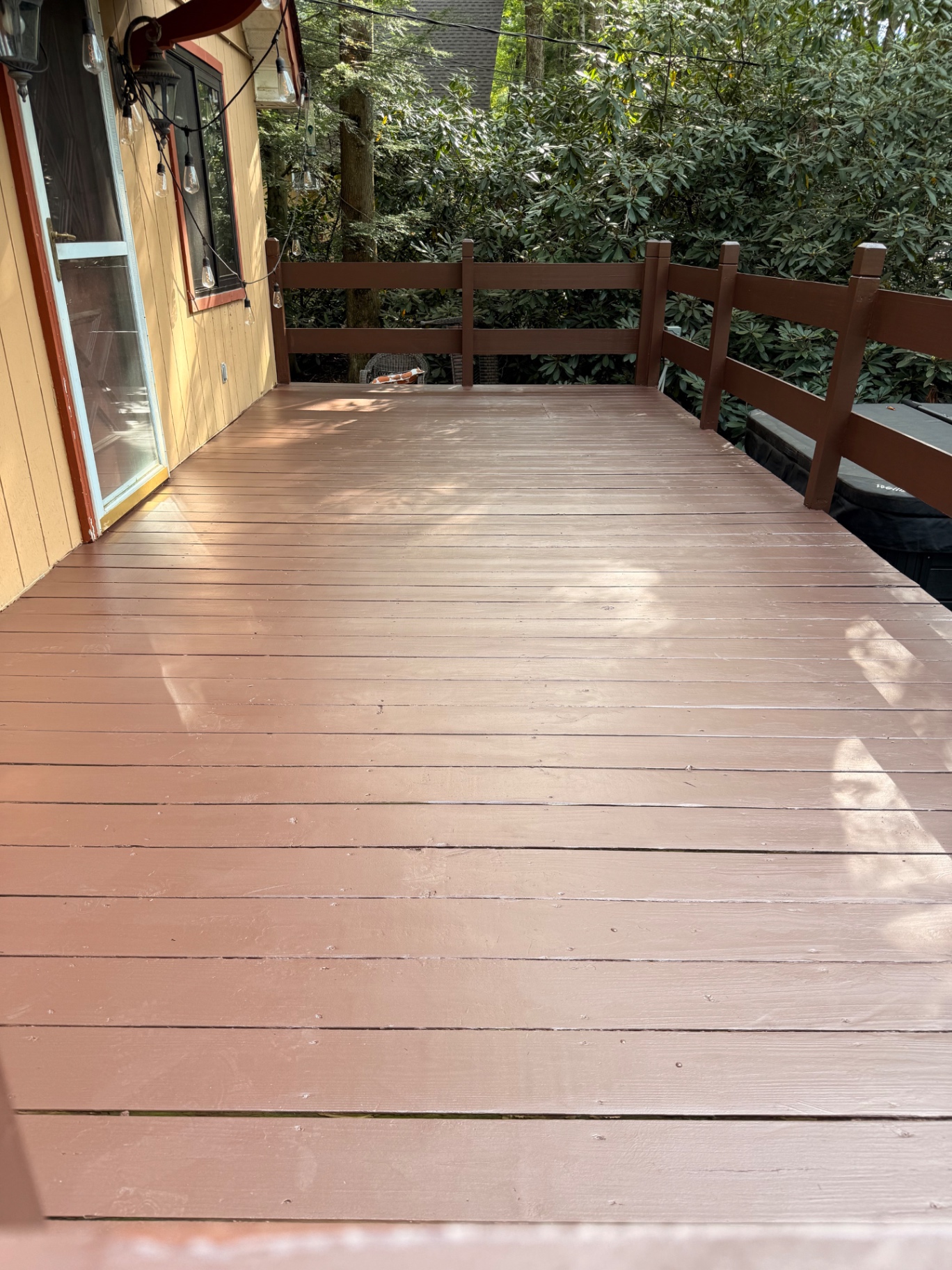 Refinished brown deck surface after restoration